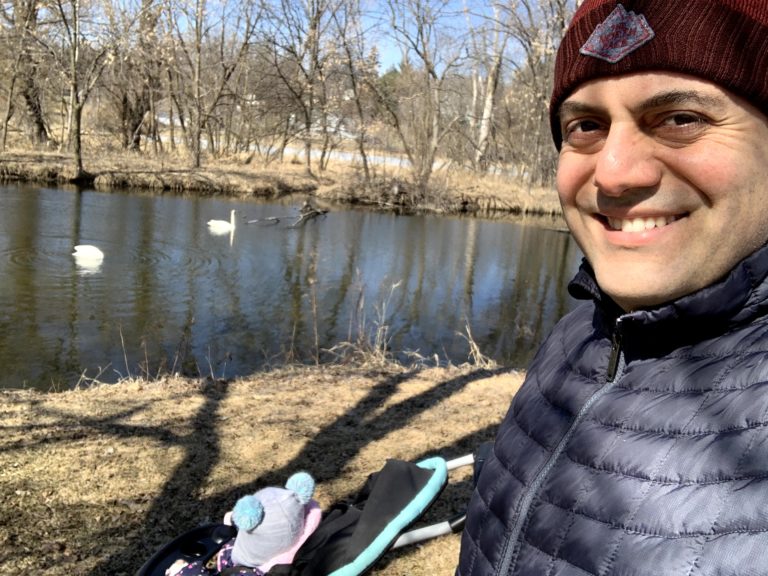 Davit Gharibyan in front of water with his daughtr Natalie